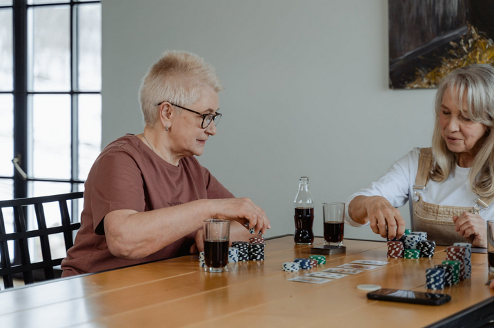 two ladies playing poker